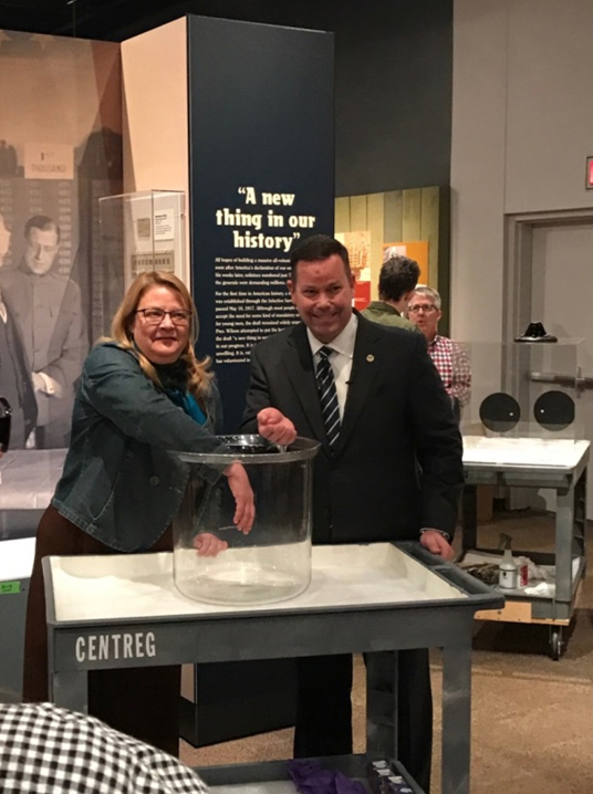 Kristen Froehlich of the Philadelphia History Museum and Mr. Adam Copp reaching into the Draft Lottery Bowl.