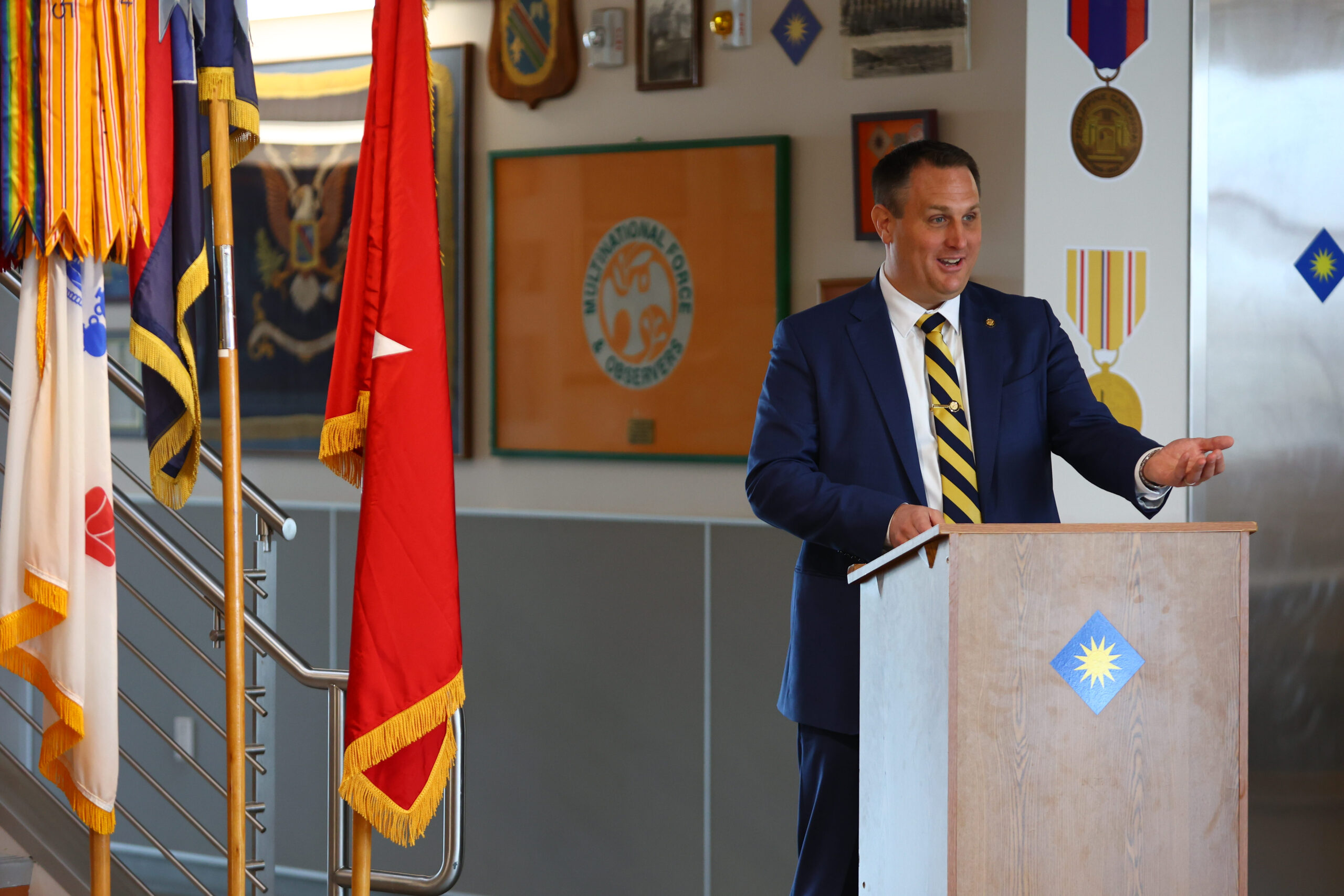 Selective Service System Acting Director Joel C. Spangenberg speaks before administering the oath of office to John A. Arbogast, the system’s new state director for California,